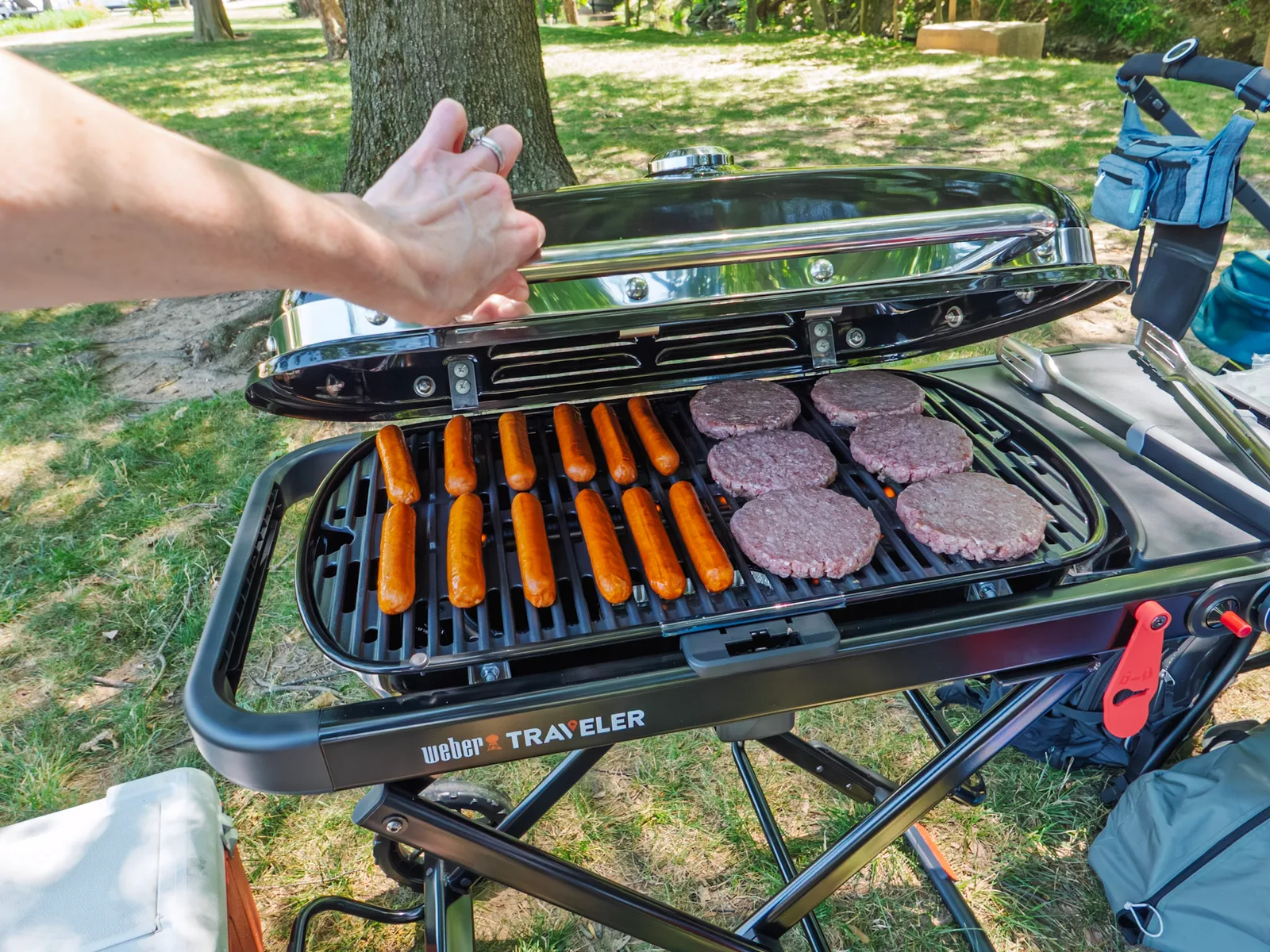 Hot dogs and burgers sizzling on the new Weber Traveler grill
