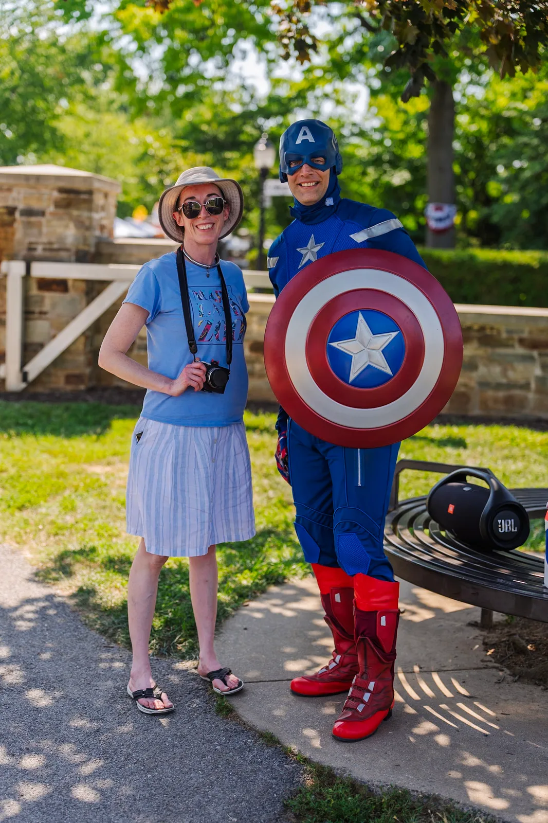 Girl in Pigtails posing with a Captain America character
