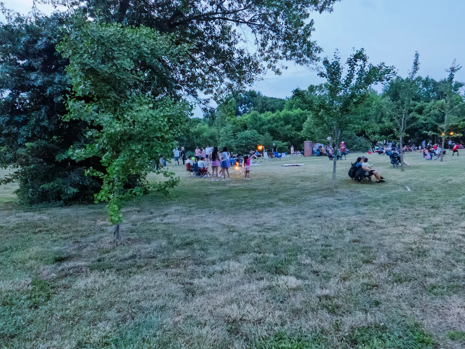 The crowd spread across the field at dusk waiting for fireworks