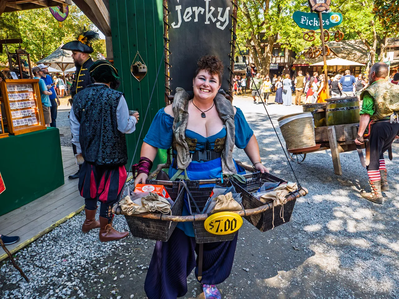 A basket vendor selling jerky with a big smile