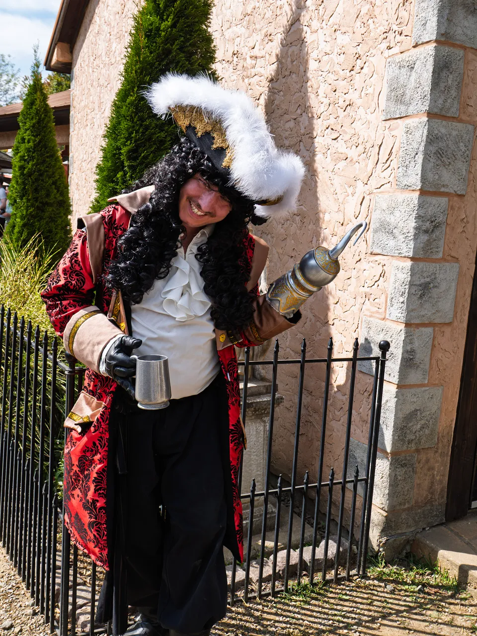 Captain Hook posing with his hook and a pewter mug